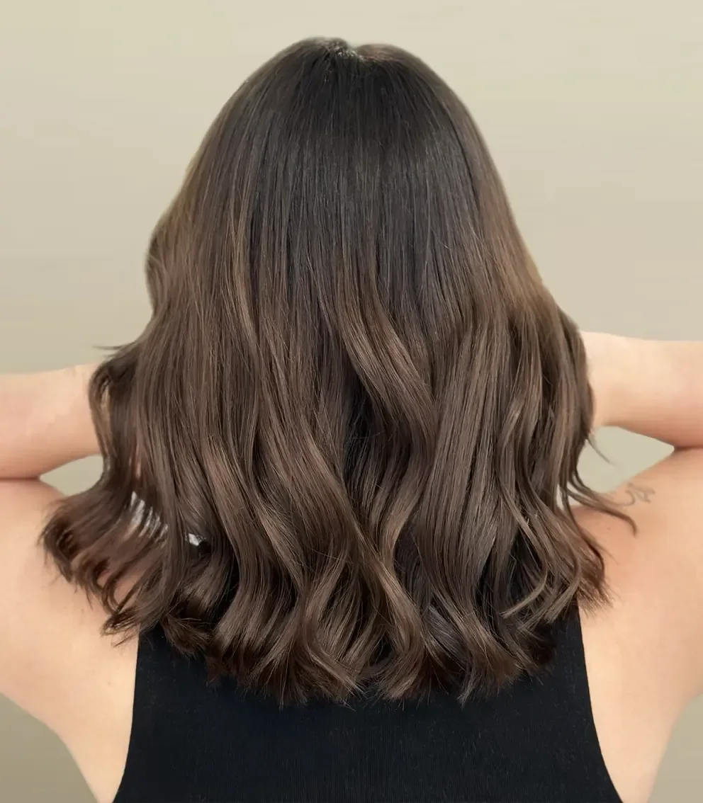 Dark Brown Collarbone Waves Back View — Winter Shoulder Length Hairstyles