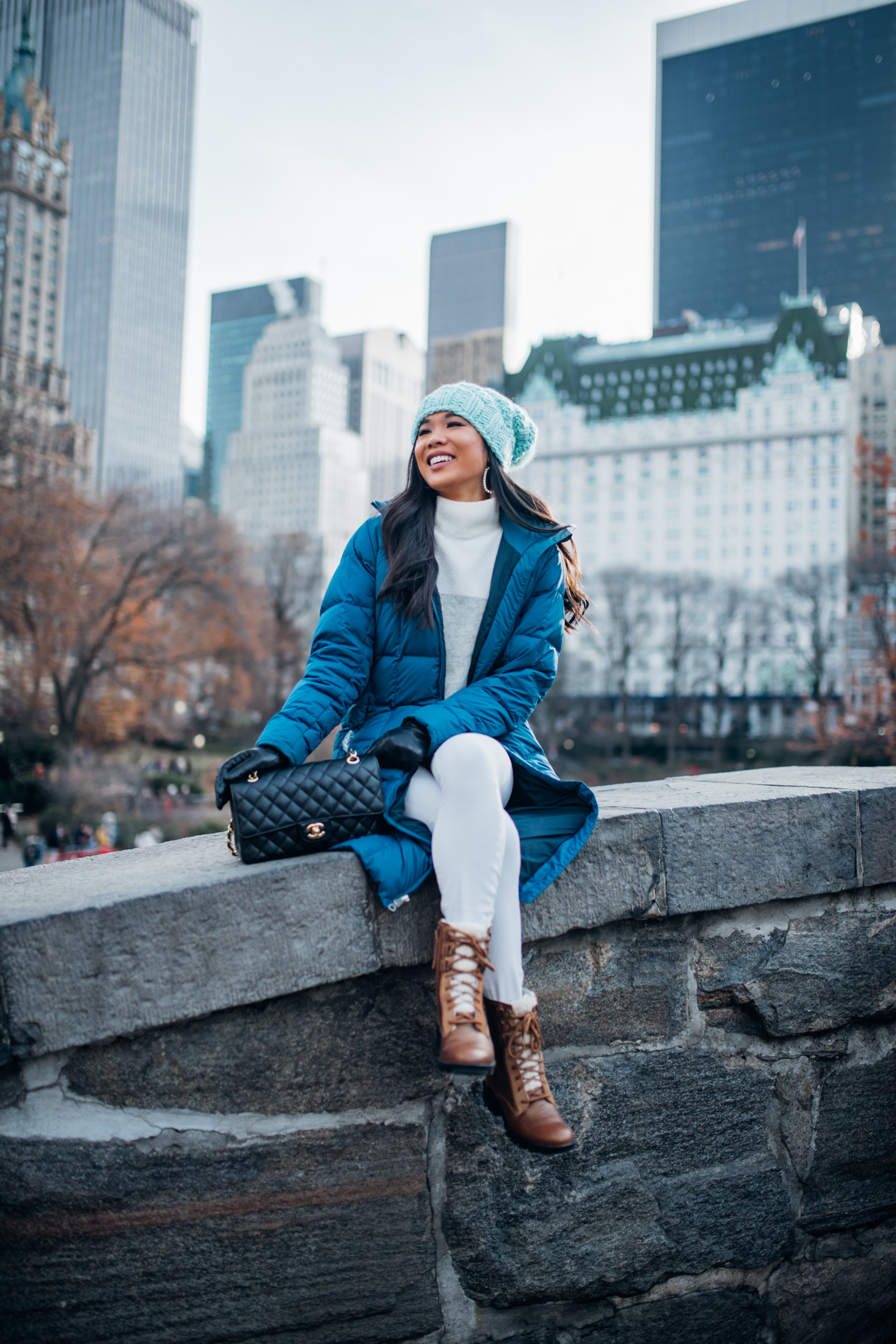 Vibrant Puffer Appeal: Blue Puffer Coat with Grey Sweater and White Pants Vibrant Puffer Appeal: Blue Puffer Coat with Grey Sweater and White Pants β Comfy Winter Outfits