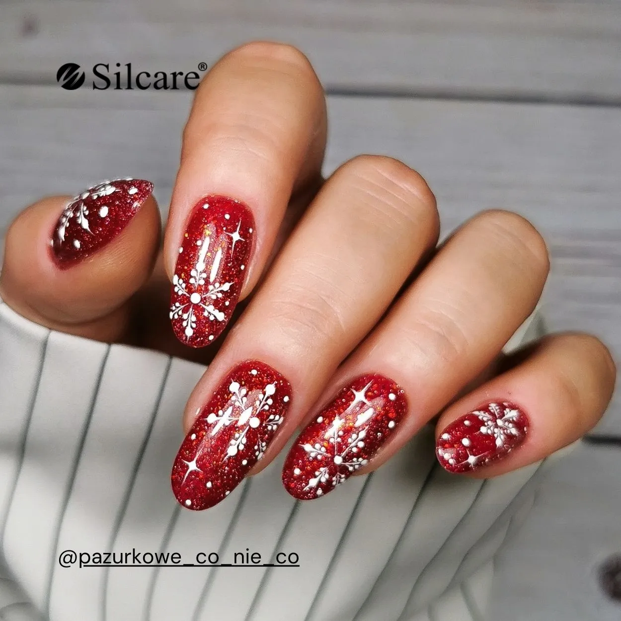 Vibrant Red Glitter Nails with White Snowflakes — Red Christmas Nails 2026