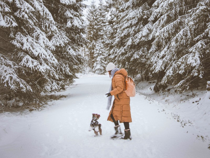 Vibrant Orange Puffer Coat in Snowy Forest — Cold Weather Outfits