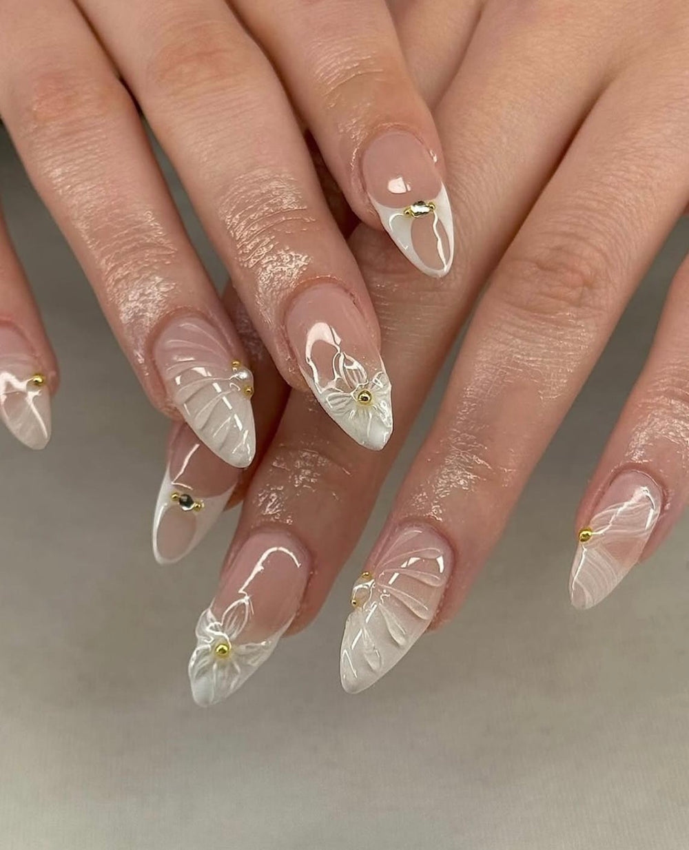 Nude French with 3D White Florals and Gold Beads Nude French with 3D White Florals and Gold Beads β Coquette Winter Nails