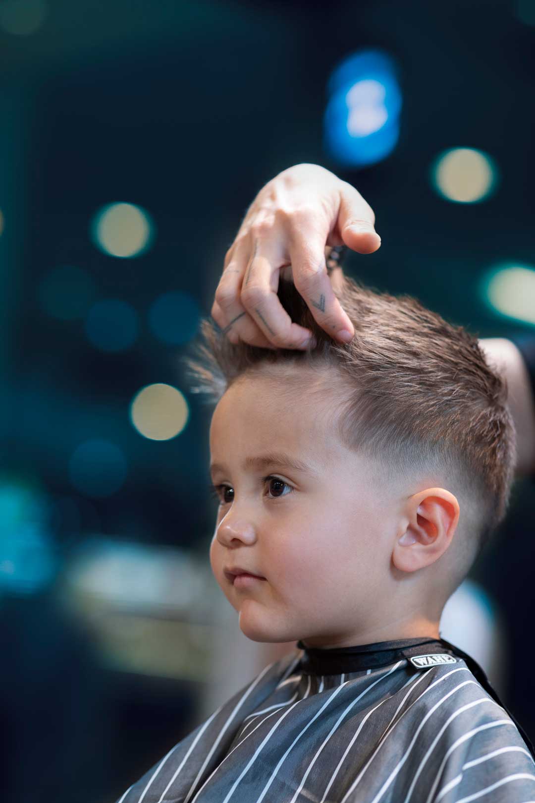 Fade With Textured Upward Style — Winter Haircuts for Boys