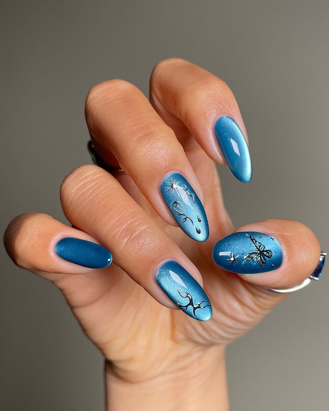 Teal Cat-Eye Butterfly Almond Nails Teal Cat-Eye Butterfly Almond Nails β Winter Birthday Nails