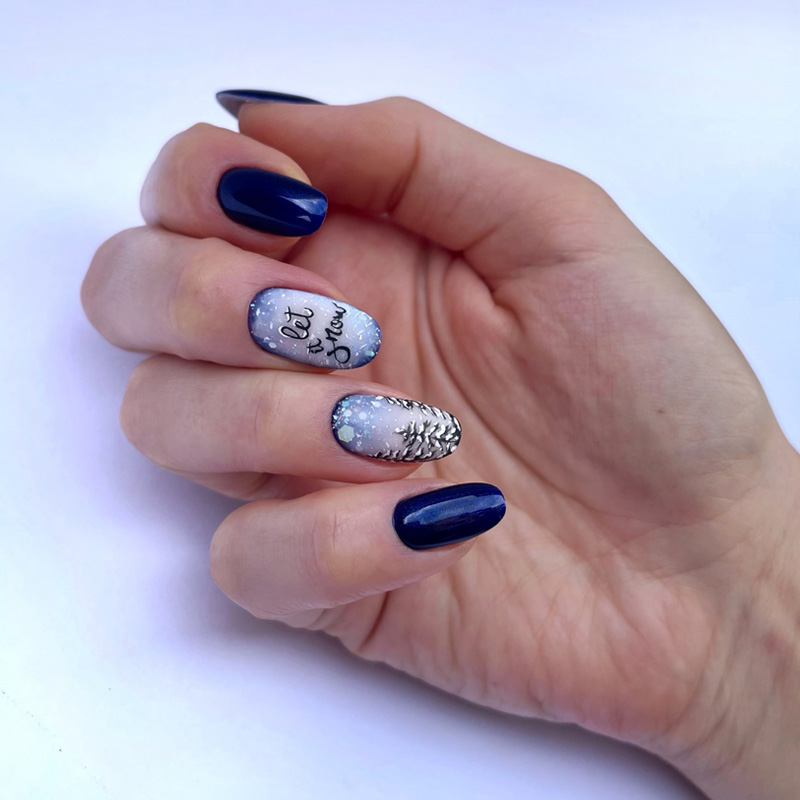 Short Oval Blue with Winter Motifs Short Oval Blue with Winter Motifs β Christmas Almond Nails 2026