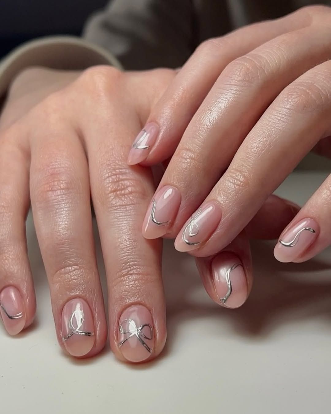 Sheer Nude with Wavy Silver Lines Sheer Nude with Wavy Silver Lines β Clean Girl Winter Nails