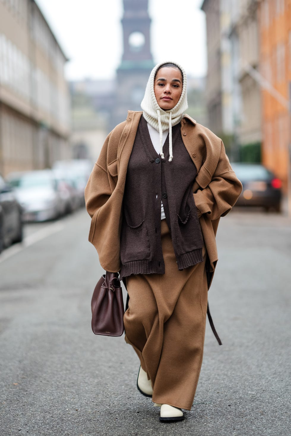 Layered Neutrals: Brown Coat Over Knitwear and White Boots Layered Neutrals: Brown Coat Over Knitwear and White Boots β Winter Outfits for Women Over 40