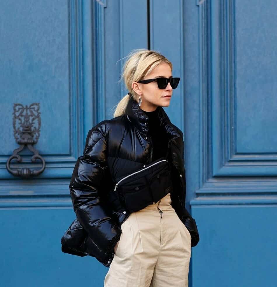 Glossy Black Puffer with Beige Trousers and Black Turtleneck — Winter Puffer Jacket Outfits