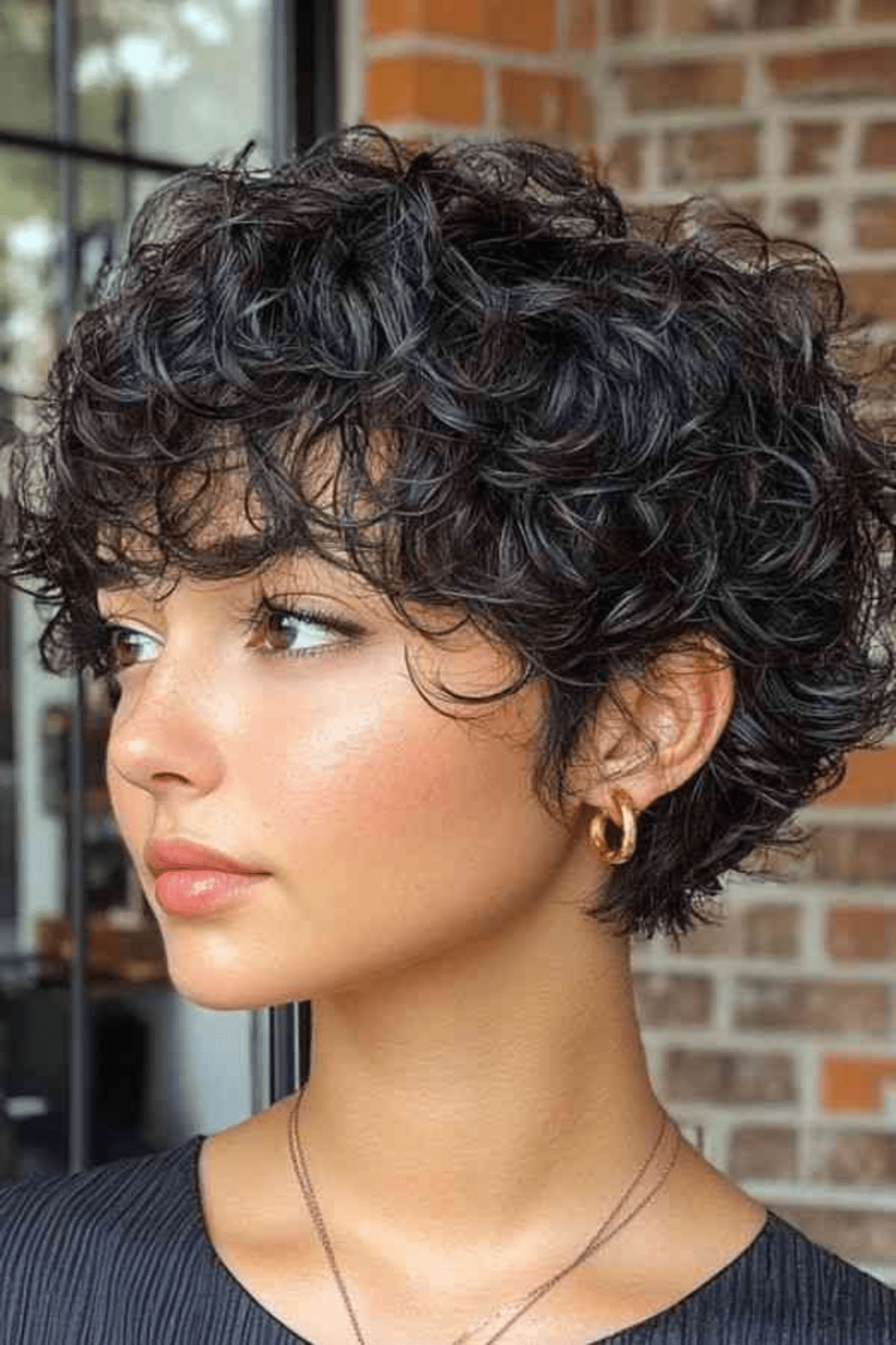 Short Pixie With Textured Bangs — Winter Haircuts for Curly Hair