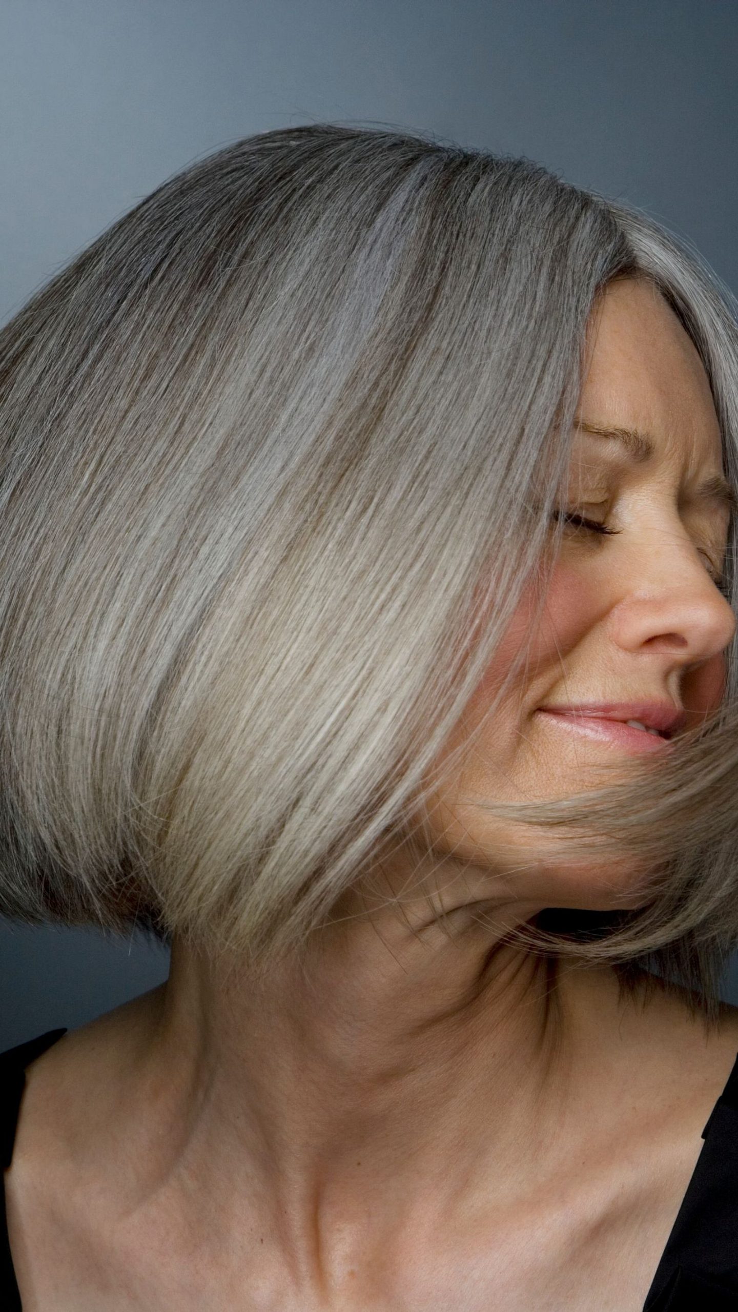 Ear-Length Ash Gray Bob With Wispy Bangs Ear-Length Ash Gray Bob With Wispy Bangs β Winter Haircuts for Gray Hair