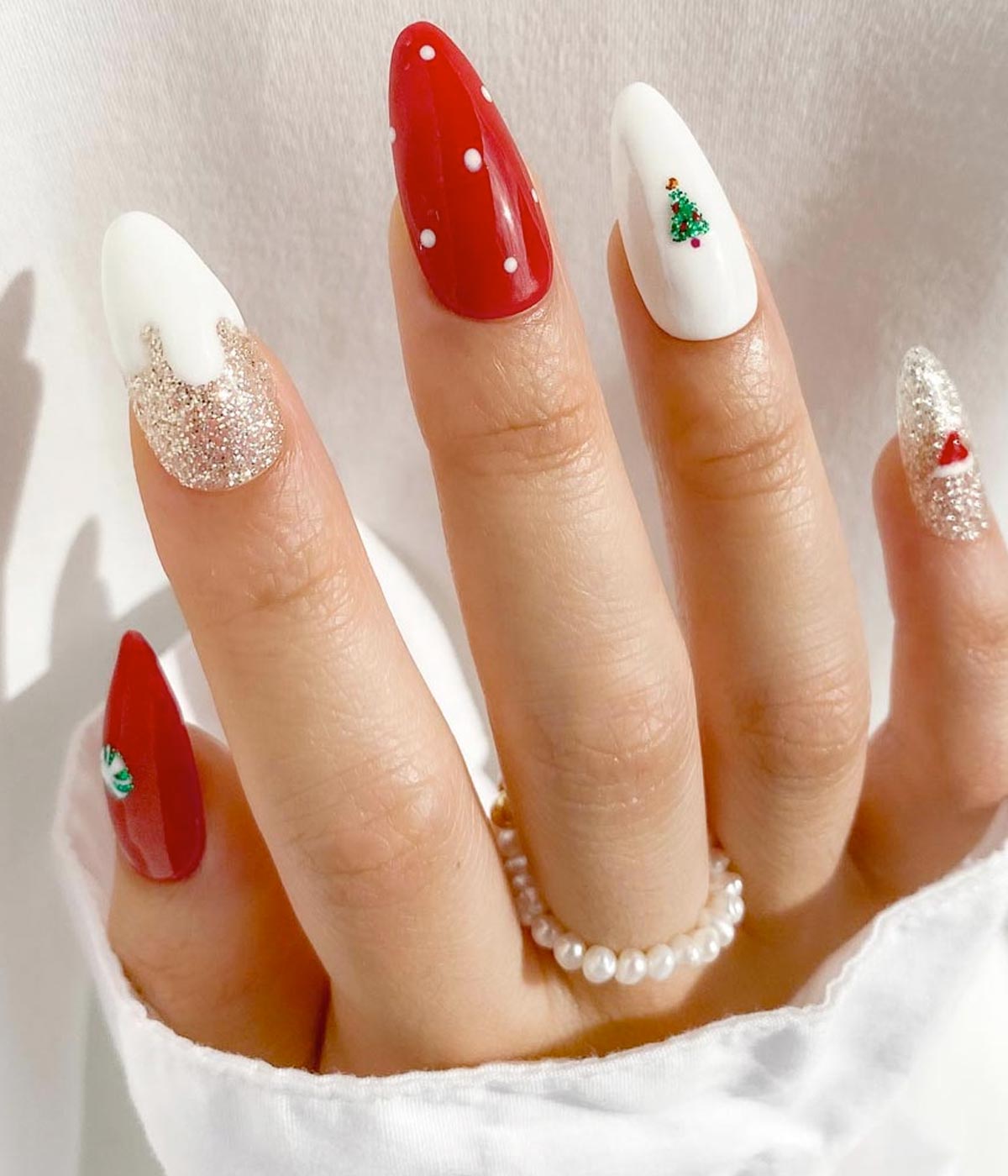 Red Nails with White Polka Dots and Christmas Graphics — Red Christmas Nails 2026