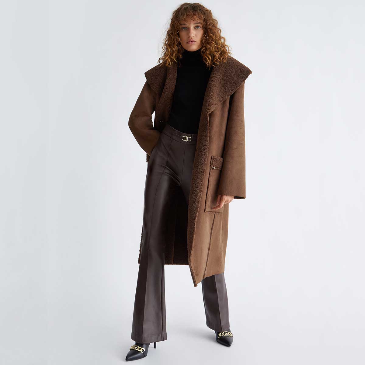 Long Brown Coat With Sherpa Collar And Faux Leather Pants — Long Puffer Coat Outfits