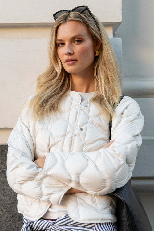 White Quilted Puffer Jacket Over a White T-Shirt — Neutral Winter Outfits