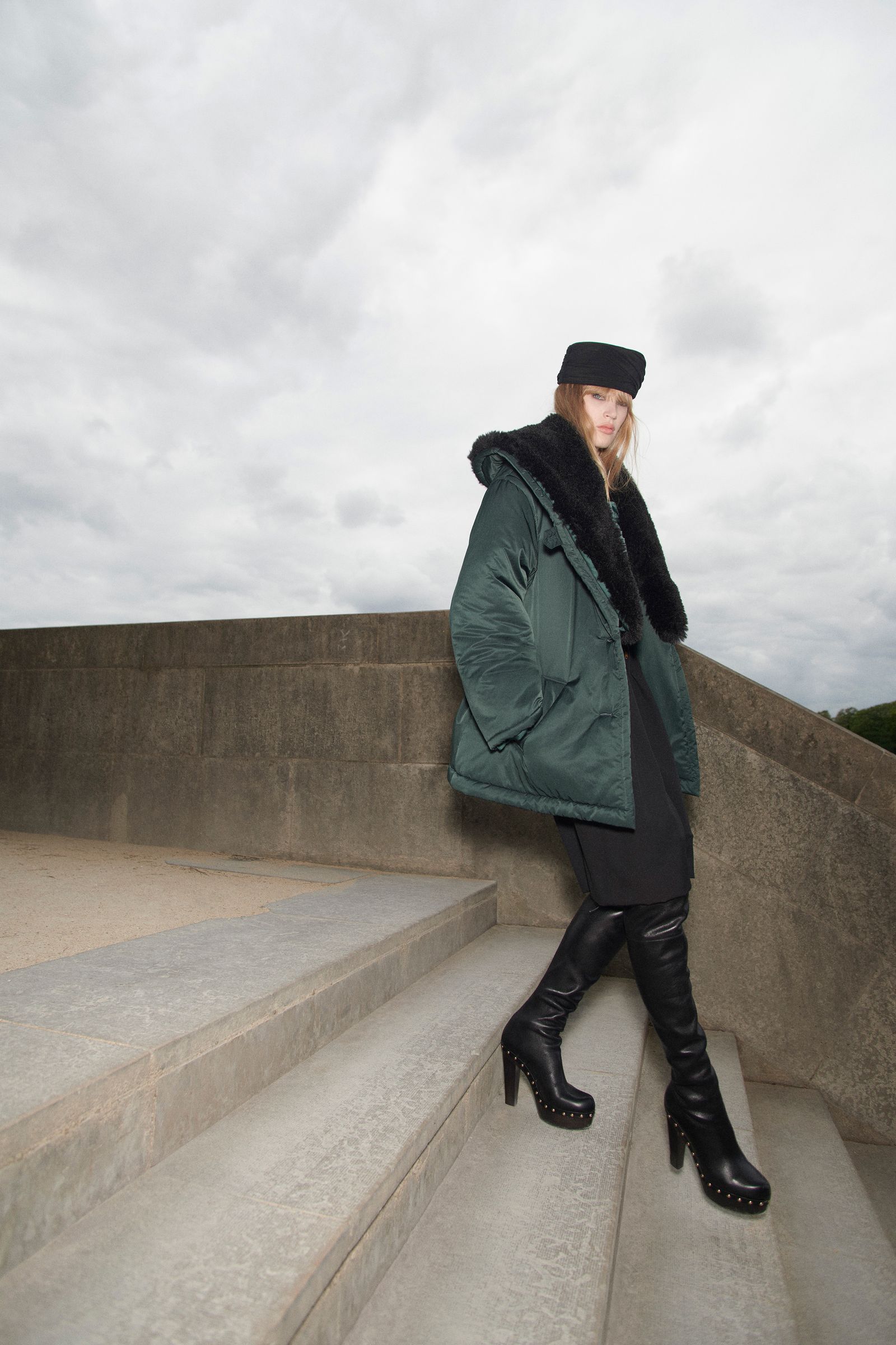 Dark Green Puffer Coat with Thigh-High Boots for Edgy Winter Style — Winter College Outfits