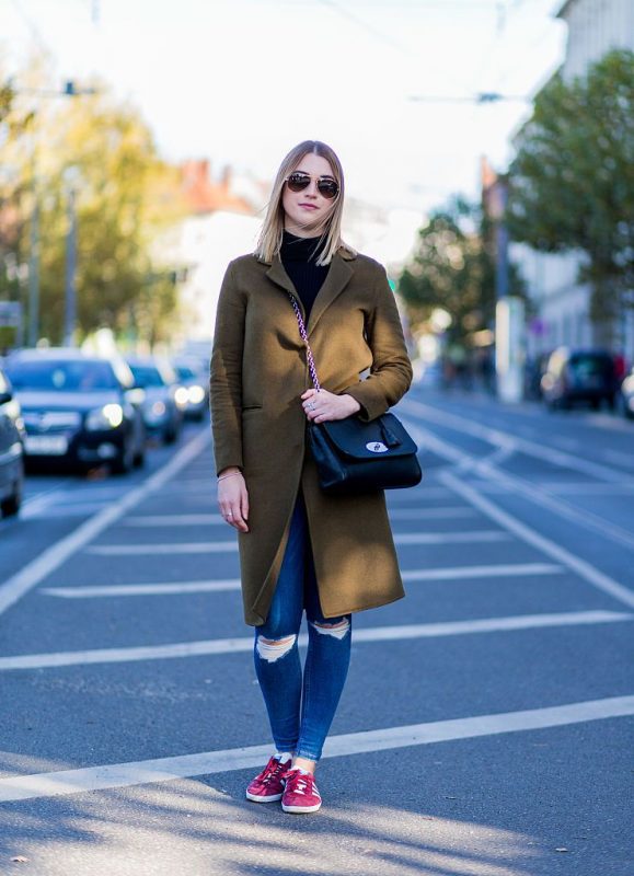 Olive Green Wool Coat with Ripped Jeans and Red Sneakers — December Outfits