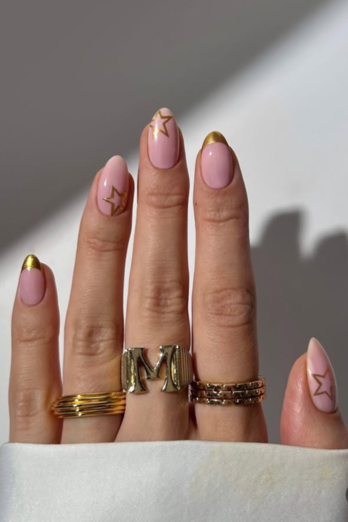 Pale Pink Almond with Gold Star Accents — Simple New Years Nails 2027