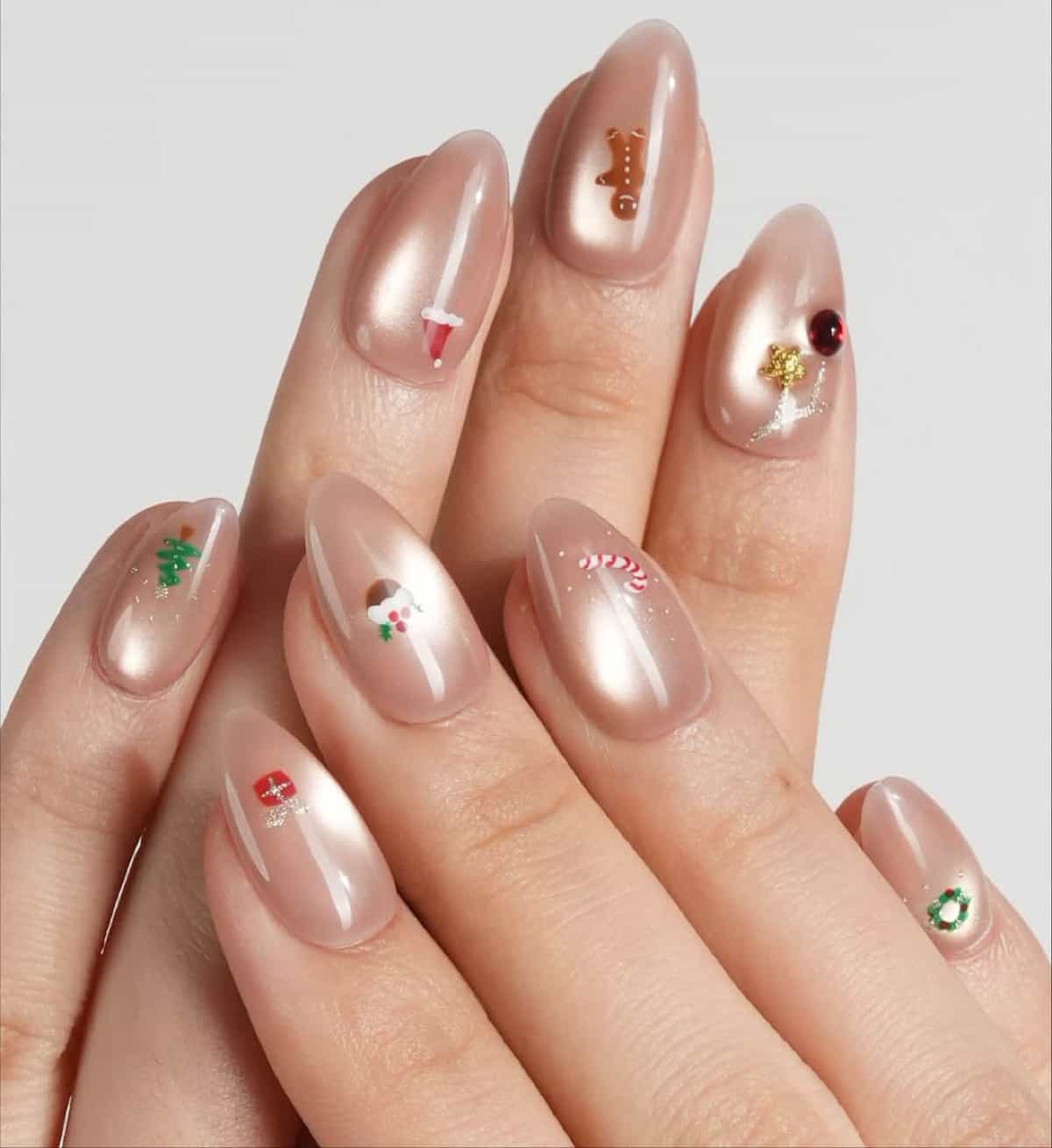 Pearlescent Almonds with Tiny Christmas Icons Pearlescent Almonds with Tiny Christmas Icons β Christmas Nail Colors 2026