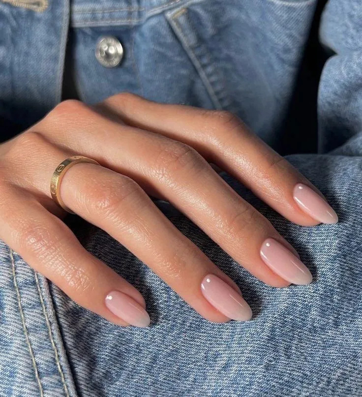 Sheer Pinkish Nude Glossy Almonds Sheer Pinkish Nude Glossy Almonds β Winter Nail Colors for Women Over 70