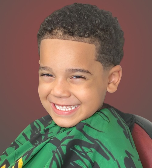 Short Curly Haircut With Sharp Faded Sides Short Curly Haircut With Sharp Faded Sides β Winter Hairstyles for Black Kids