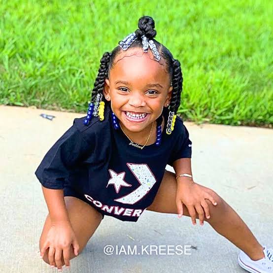 Two-Strand Twists With Colorful Beads And Top Knot Two-Strand Twists With Colorful Beads And Top Knot β Winter Hairstyles for Black Kids