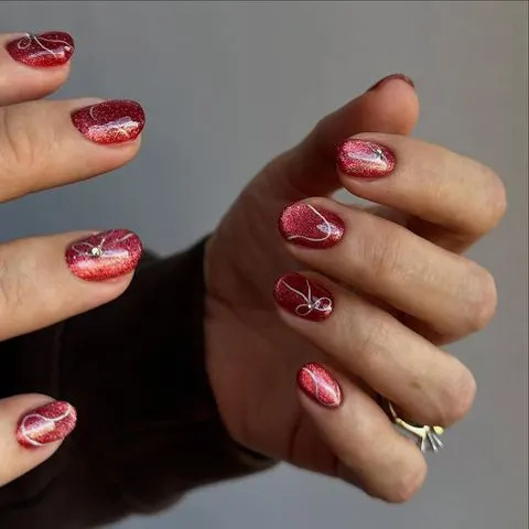 Deep Red Cat-Eye with Swirls and Rhinestones Deep Red Cat-Eye with Swirls and Rhinestones β Classy Short Winter Nails