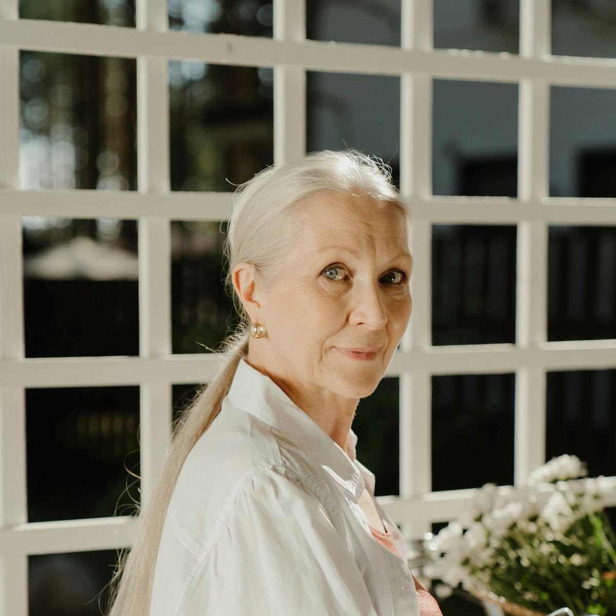 Mid-Back Blonde Waves With Darker Roots — Winter Haircuts for Women Over 60