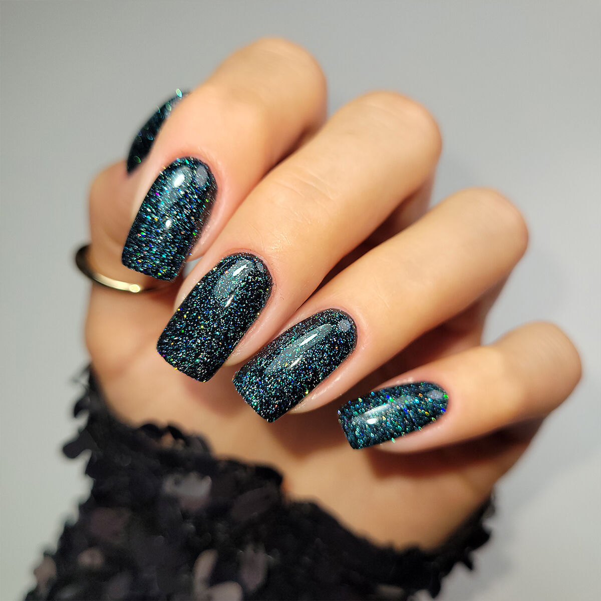 The Single Detail A Reader Notices First Medium Almond Glitter Finish — Dark Green Winter Nails