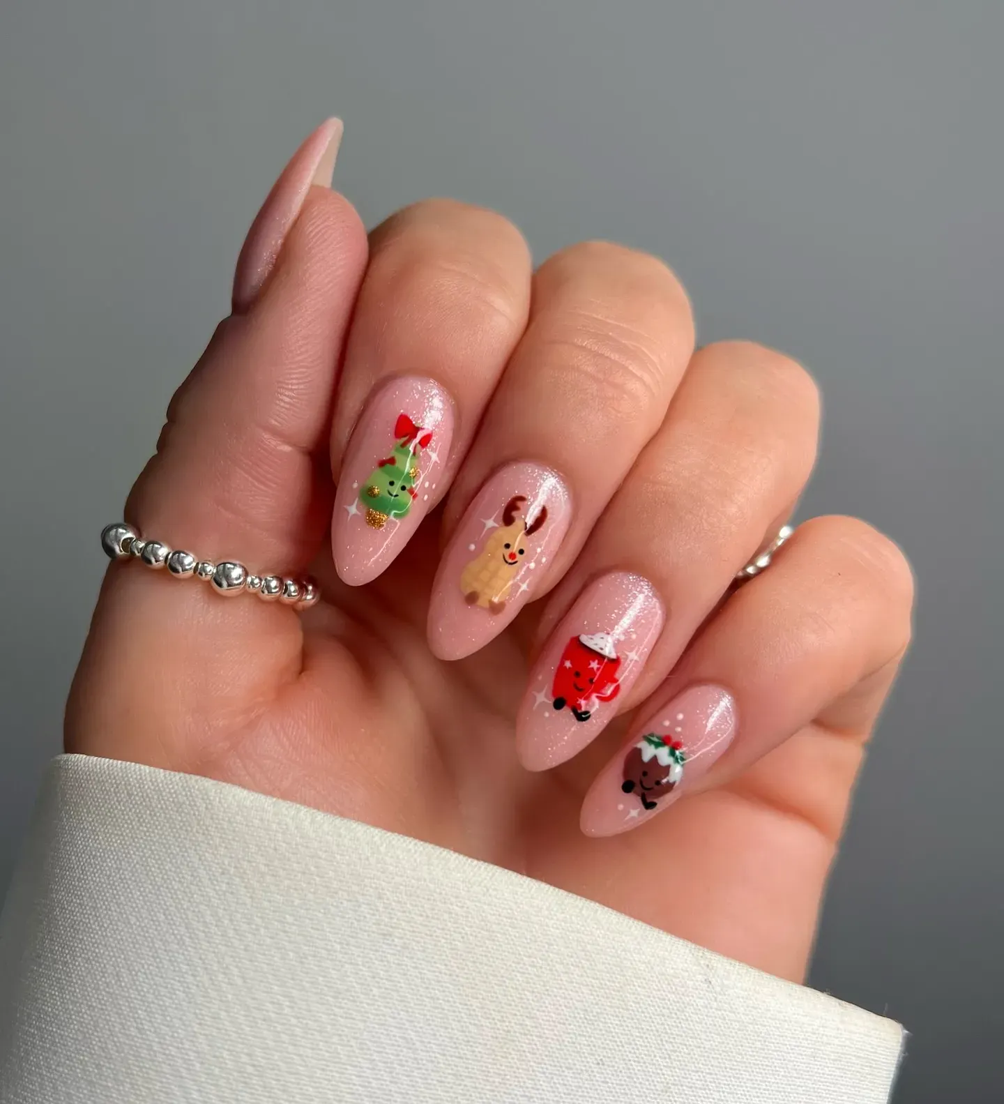 Pale Pink Cartoon Christmas Almonds Pale Pink Cartoon Christmas Almonds β Simple Christmas Nails 2026