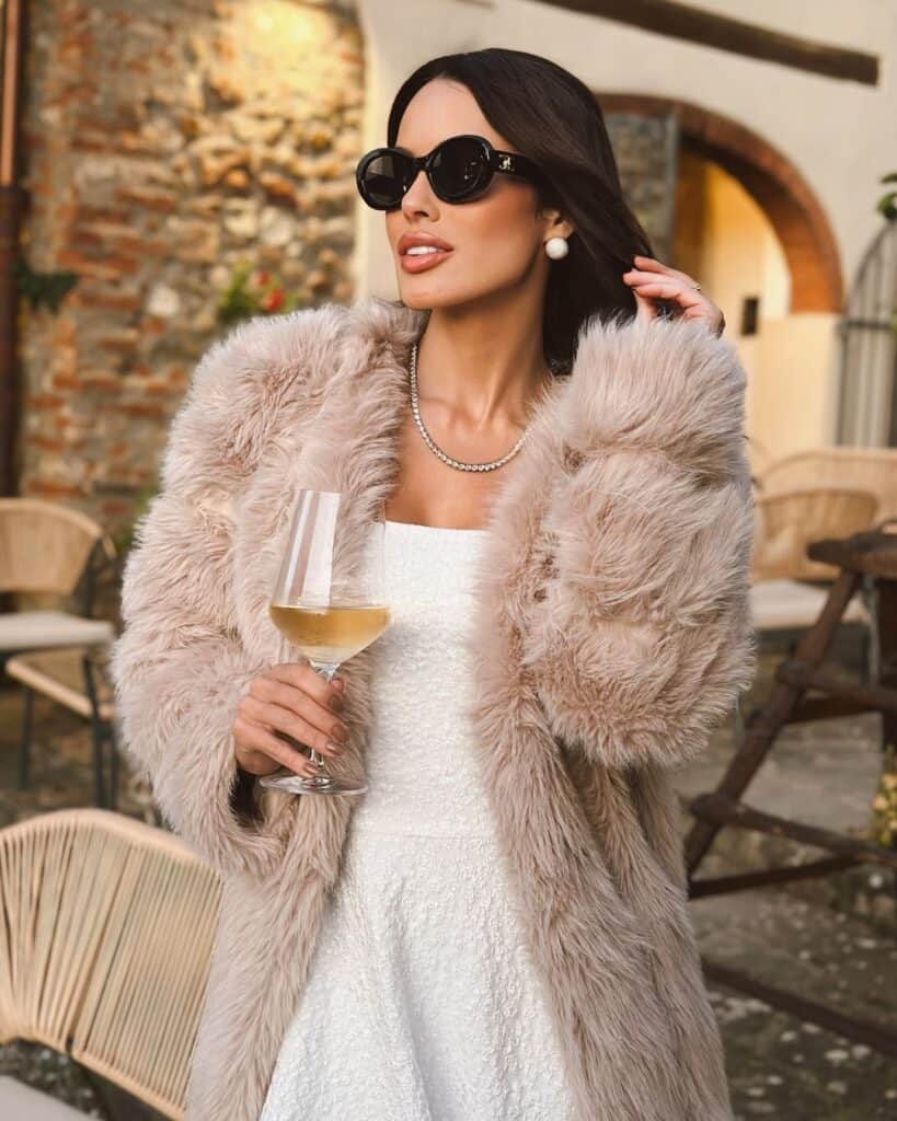 Plush Beige Faux Fur Coat Over Textured Cream Dress — Italy Winter Outfits