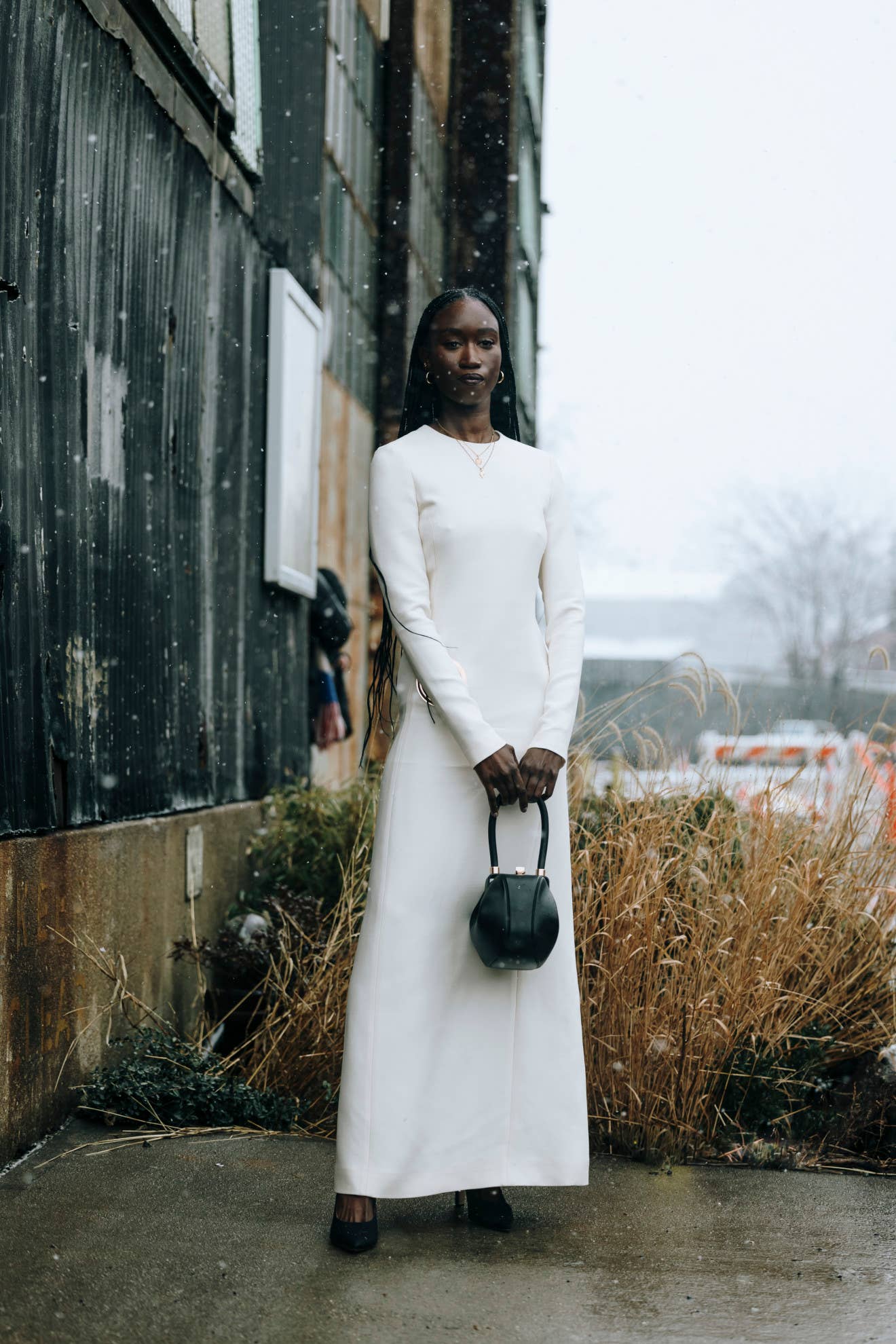 Striking White Floor-Length Dress in Snow — NYC Winter Outfits