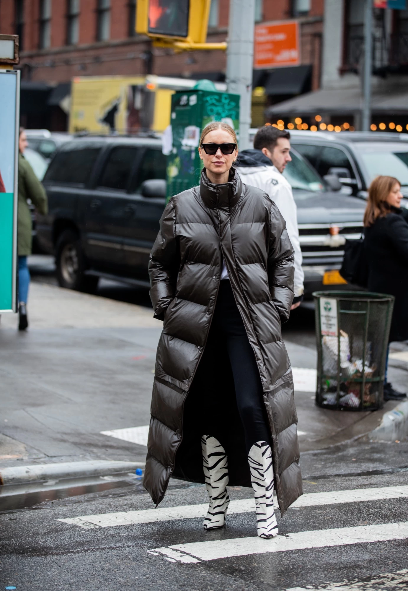 Brown Long Puffer Coat Styled With Zebra Print Boots — Long Puffer Coat Outfits
