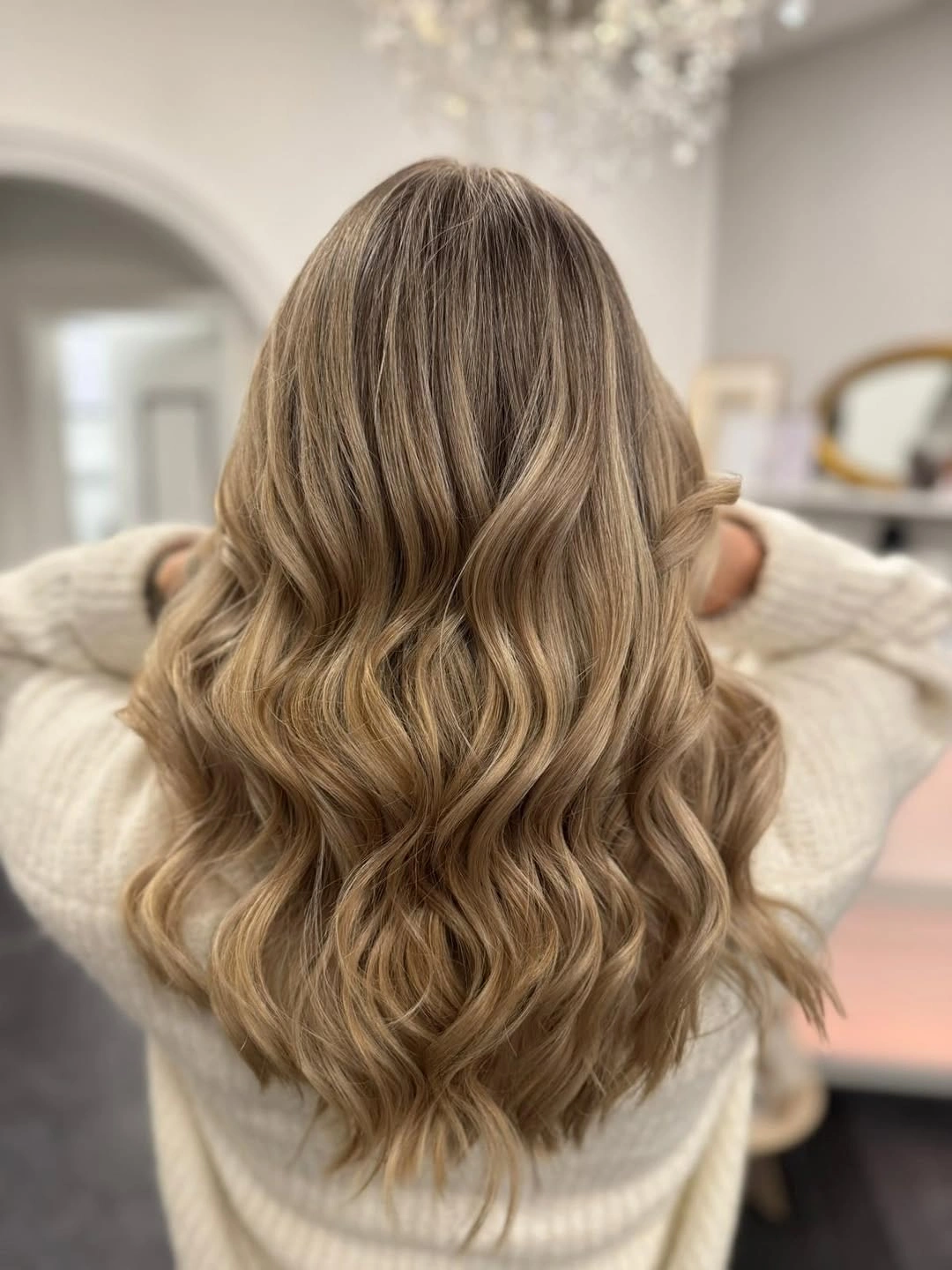 Warm light brown hair with soft lower waves