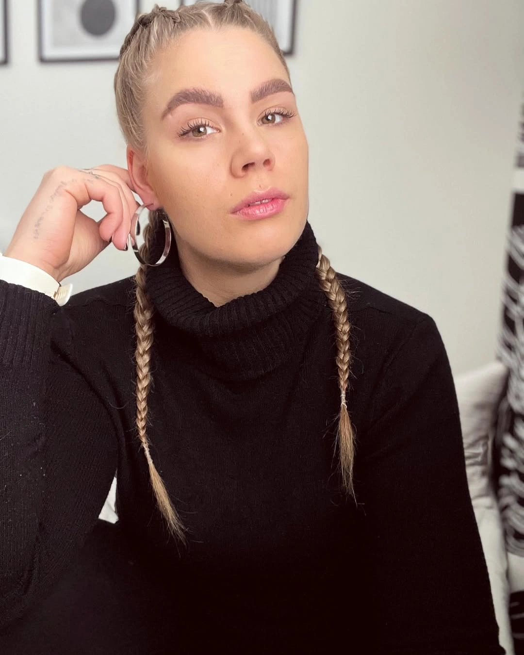 Narrow crown braids with two long light-toned braids