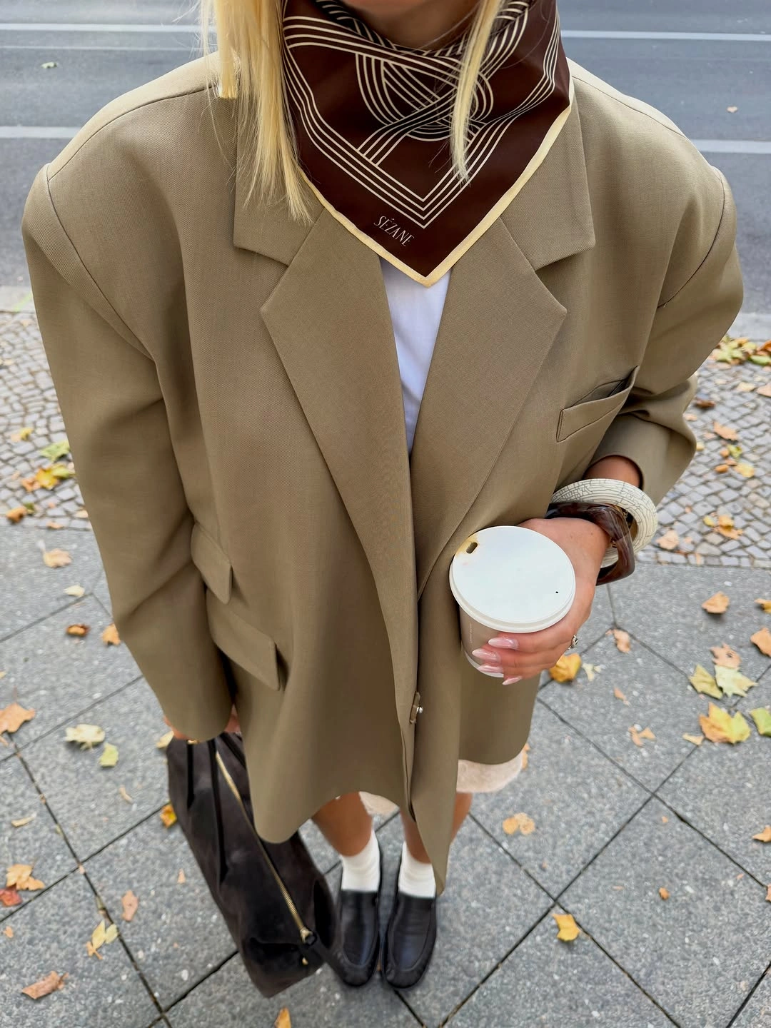Taupe blazer white top brown scarf and black loafers