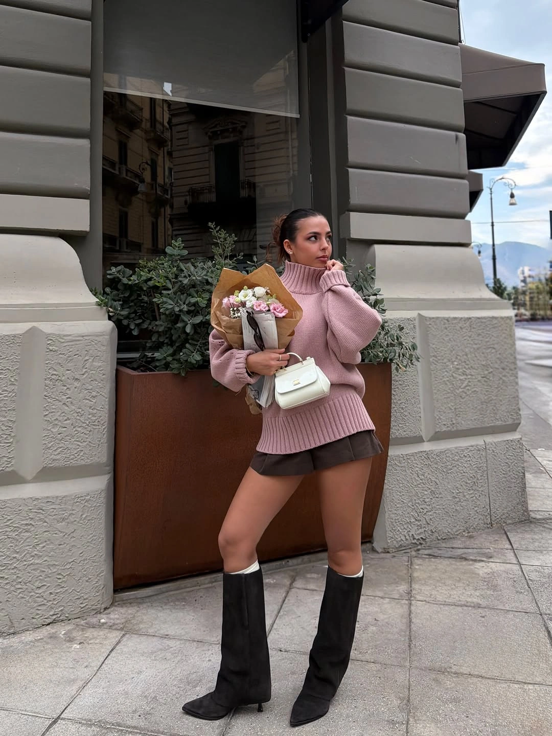 Dusty pink sweater dark mini bottom and black boots