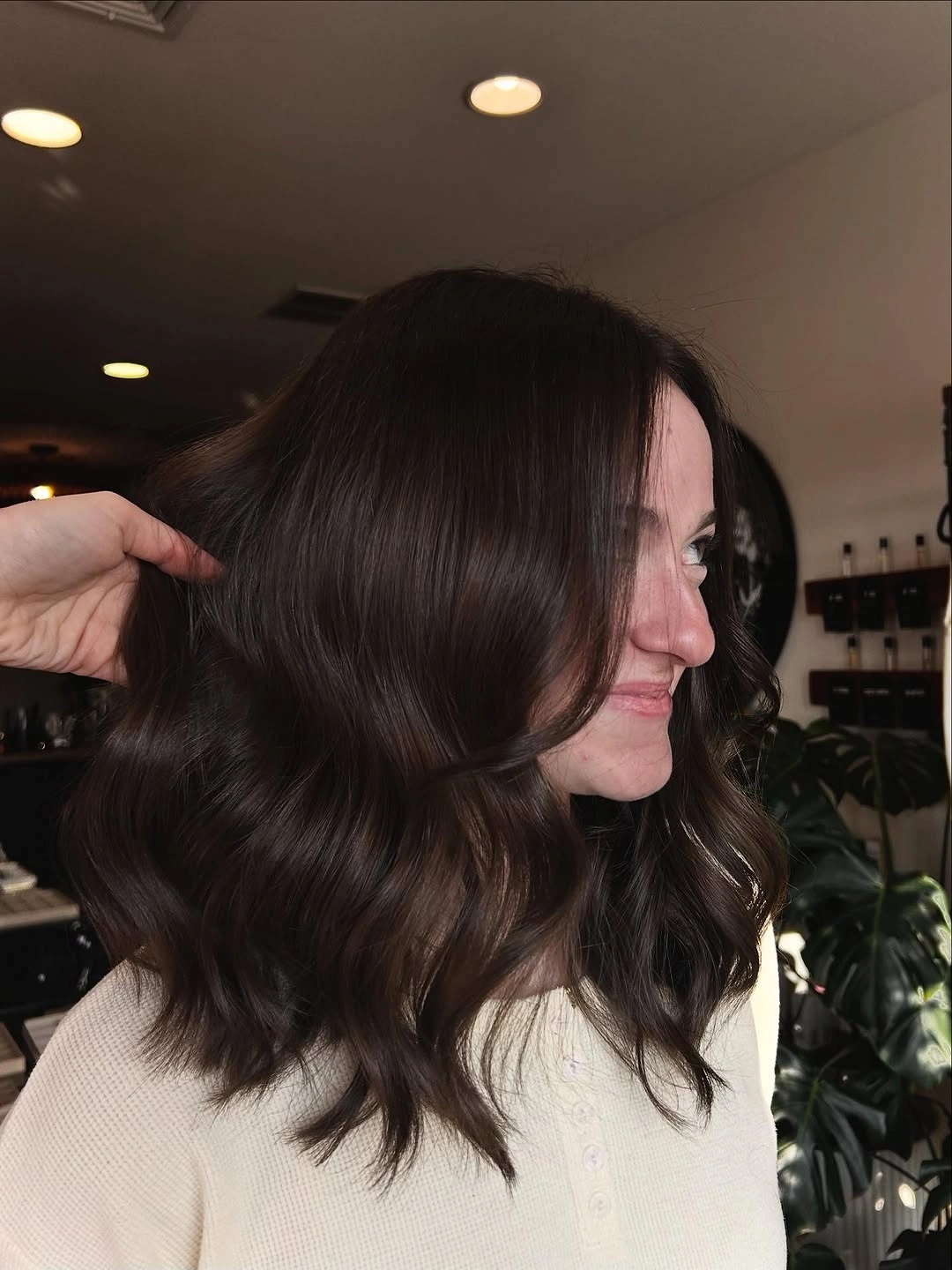 Shoulder length dark chocolate brown hair with soft glossy waves