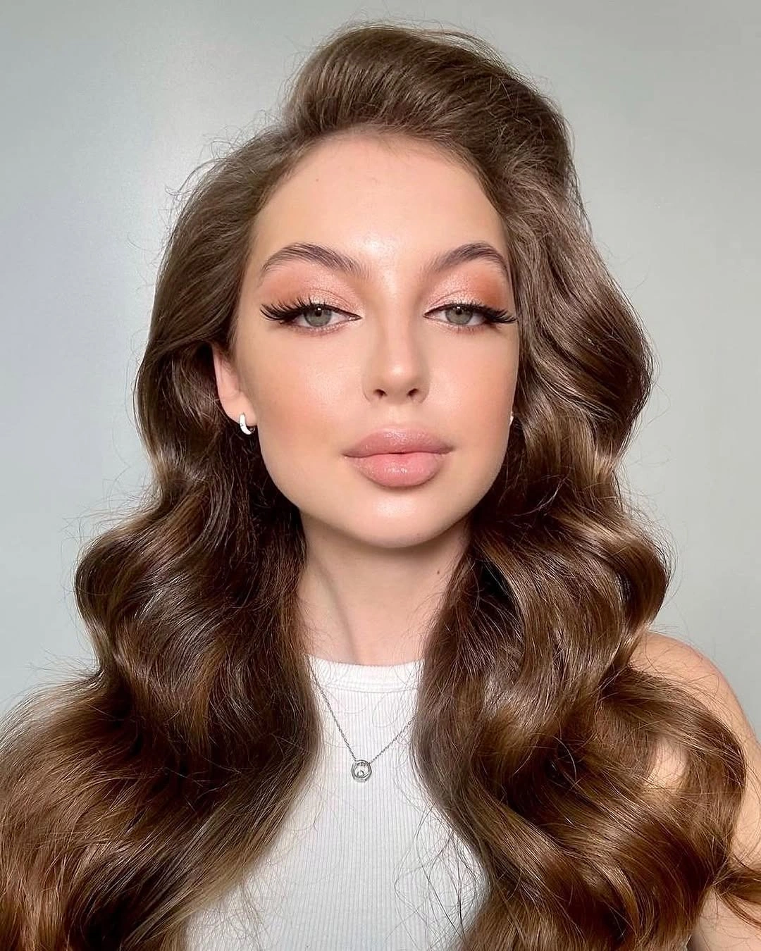 Long deep brunette hair with lifted front and broad glossy waves