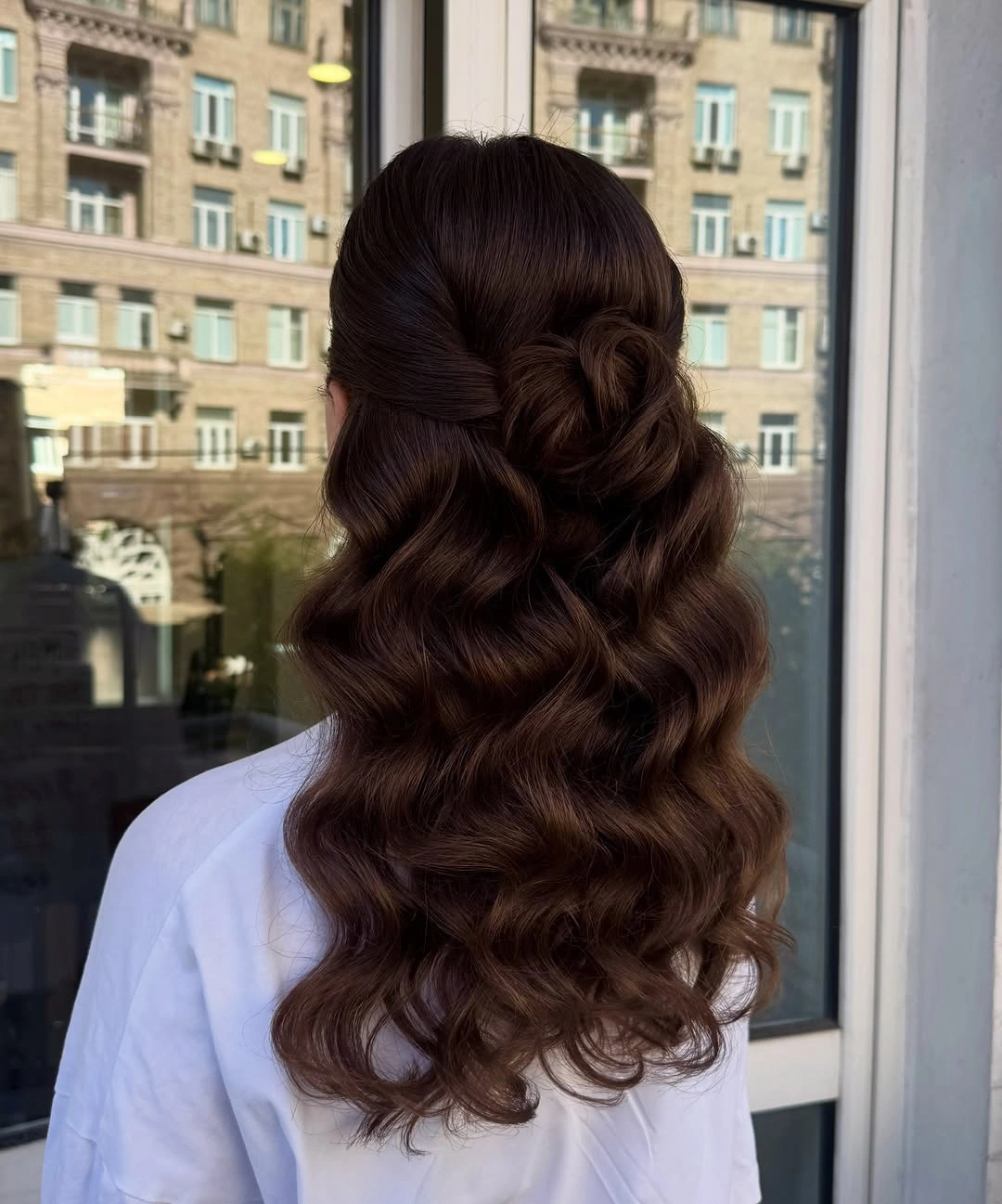 Long chocolate brown waves with rounded looped detail at the back