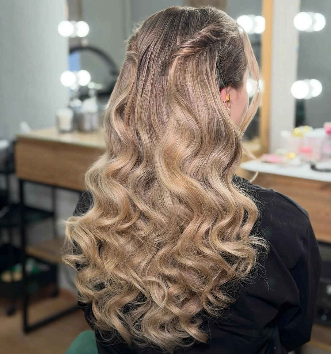 Long dimensional blonde curls with narrow crossed side section