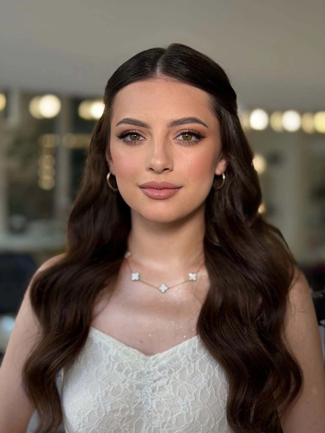 Very long dark brunette hair with smooth crown and wide waves