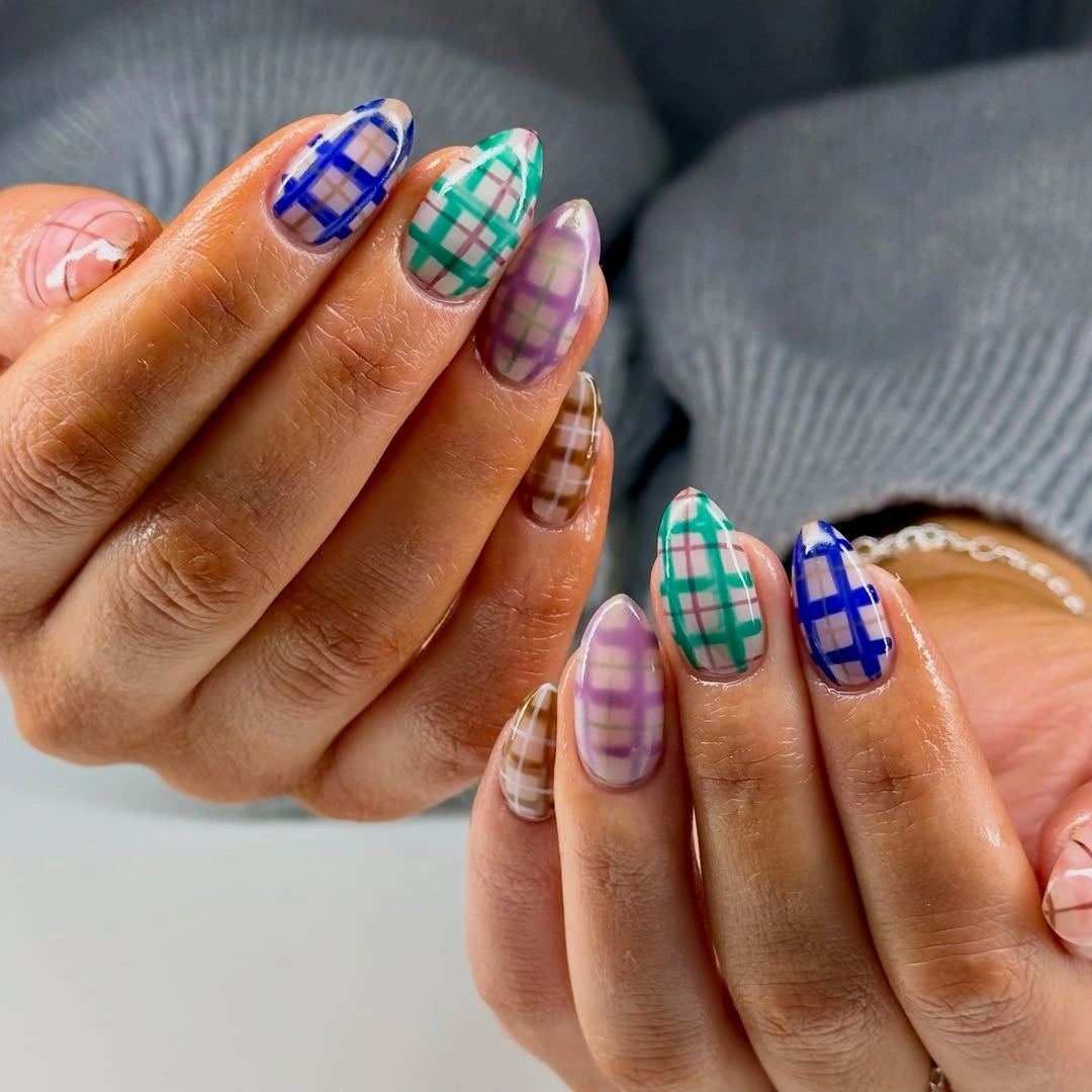 Almond nails with blue, teal, purple, and brown plaid grids