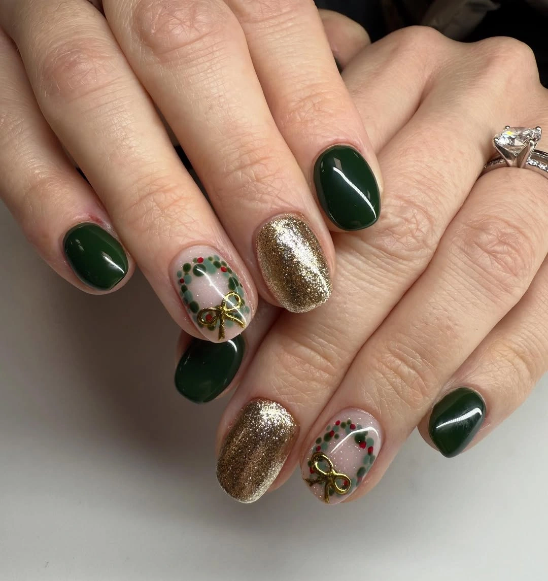 Short forest green nails with gold glitter and miniature wreath designs