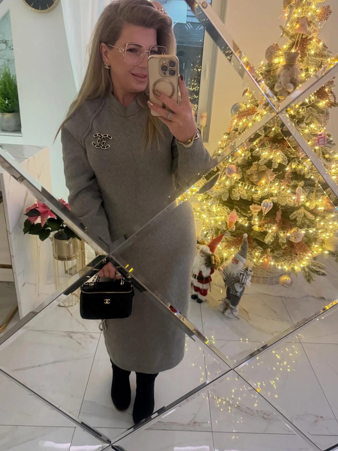 Gray knee-length knit dress with black tights and ankle boots