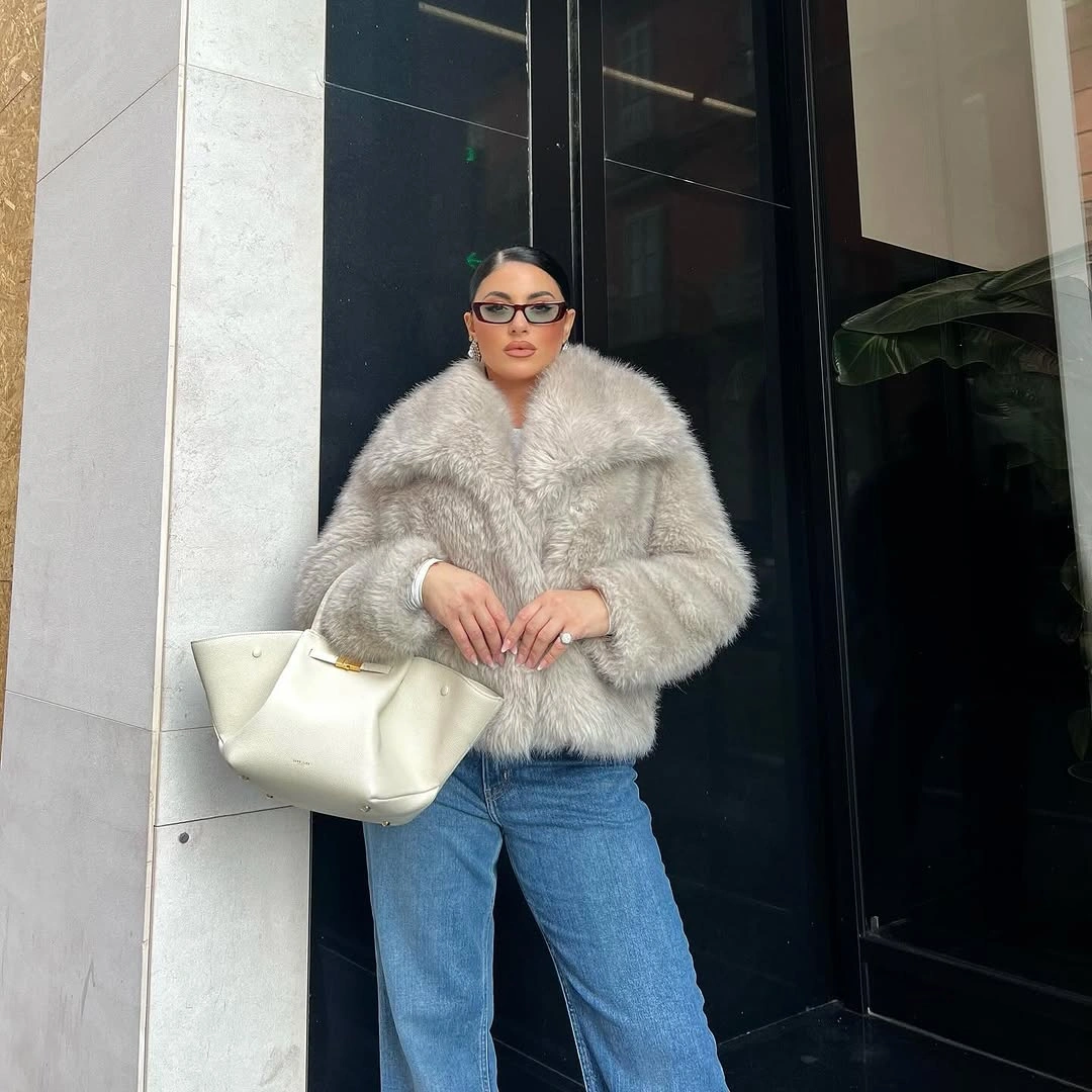 Pale gray shaggy jacket with blue jeans and off-white tote