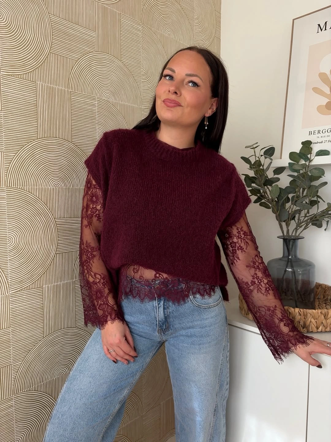 Burgundy fuzzy knit layer over sheer lace top with jeans