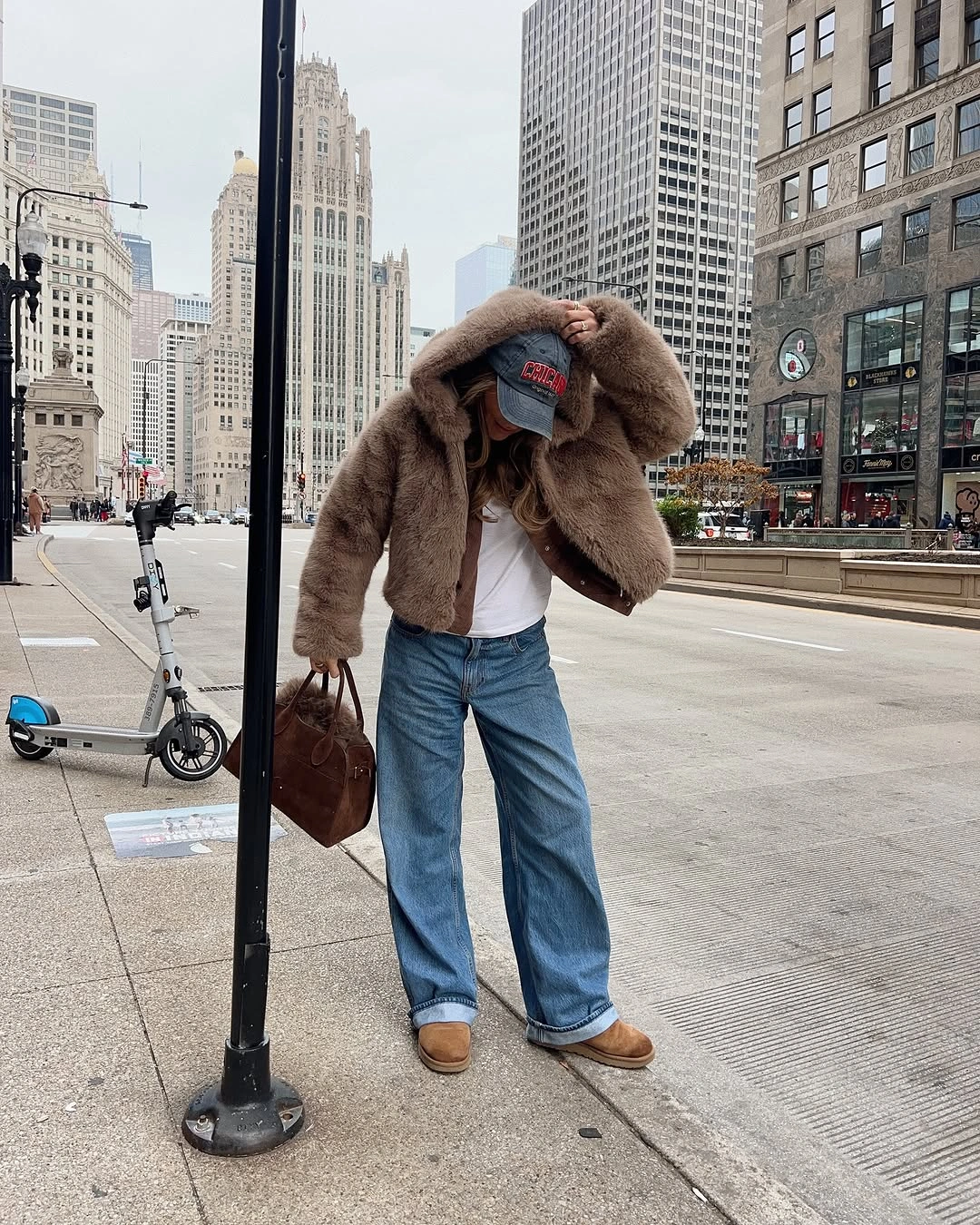 Brown cropped jacket with wide-leg jeans and tan shoes