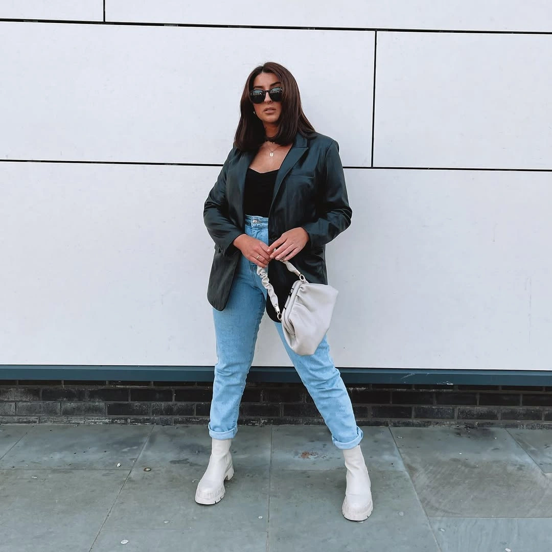 Dark green blazer with cuffed jeans and white ankle boots