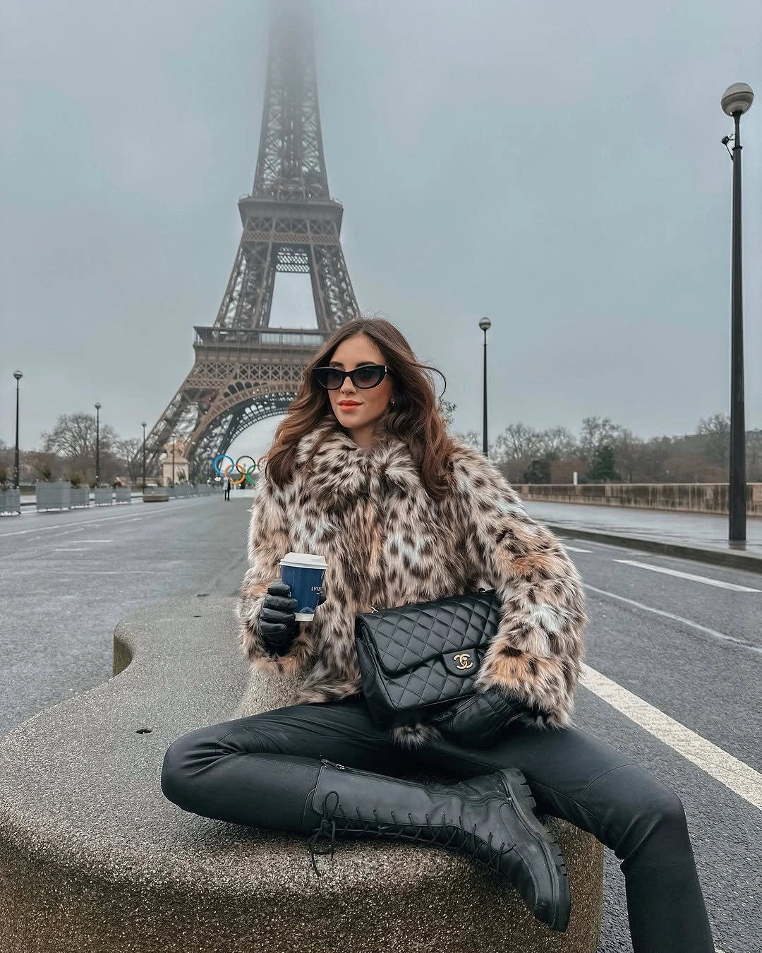 Spotted cream and dark jacket with black trousers and lace-up boots