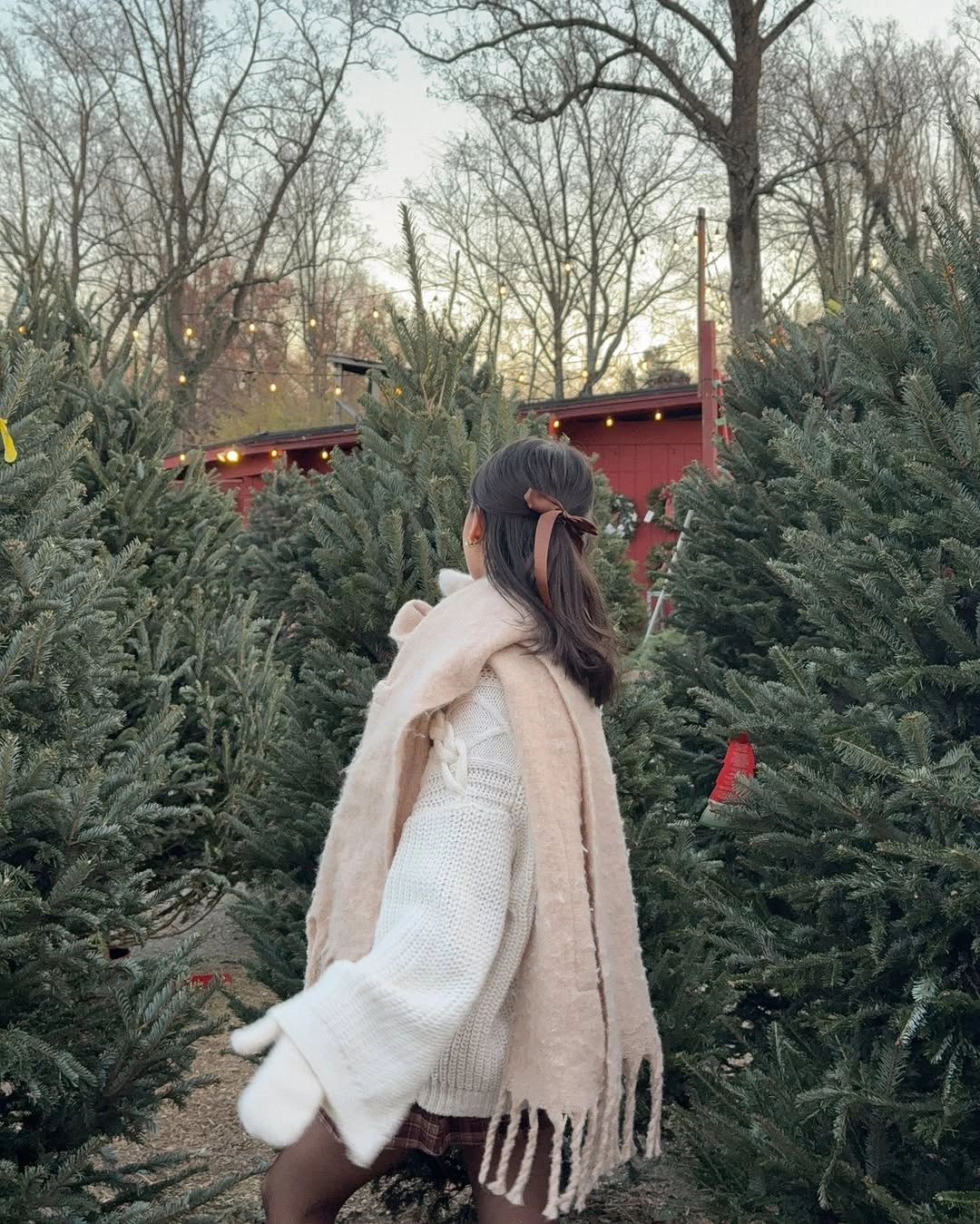 Oversized cream knit with long fringed scarf and white mittens