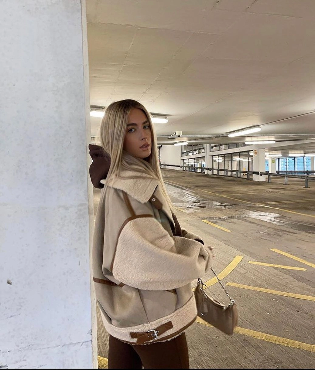 Taupe paneled jacket with fuzzy cream sleeves, brown hood, and matching pants.