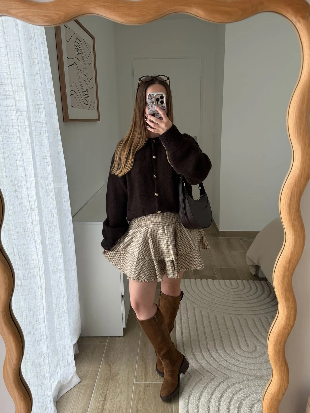 Brown cardigan with checked pleated mini skirt and knee-high boots